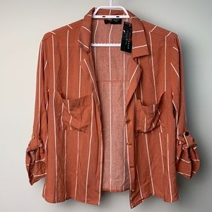 Striped shirt with gold buttons